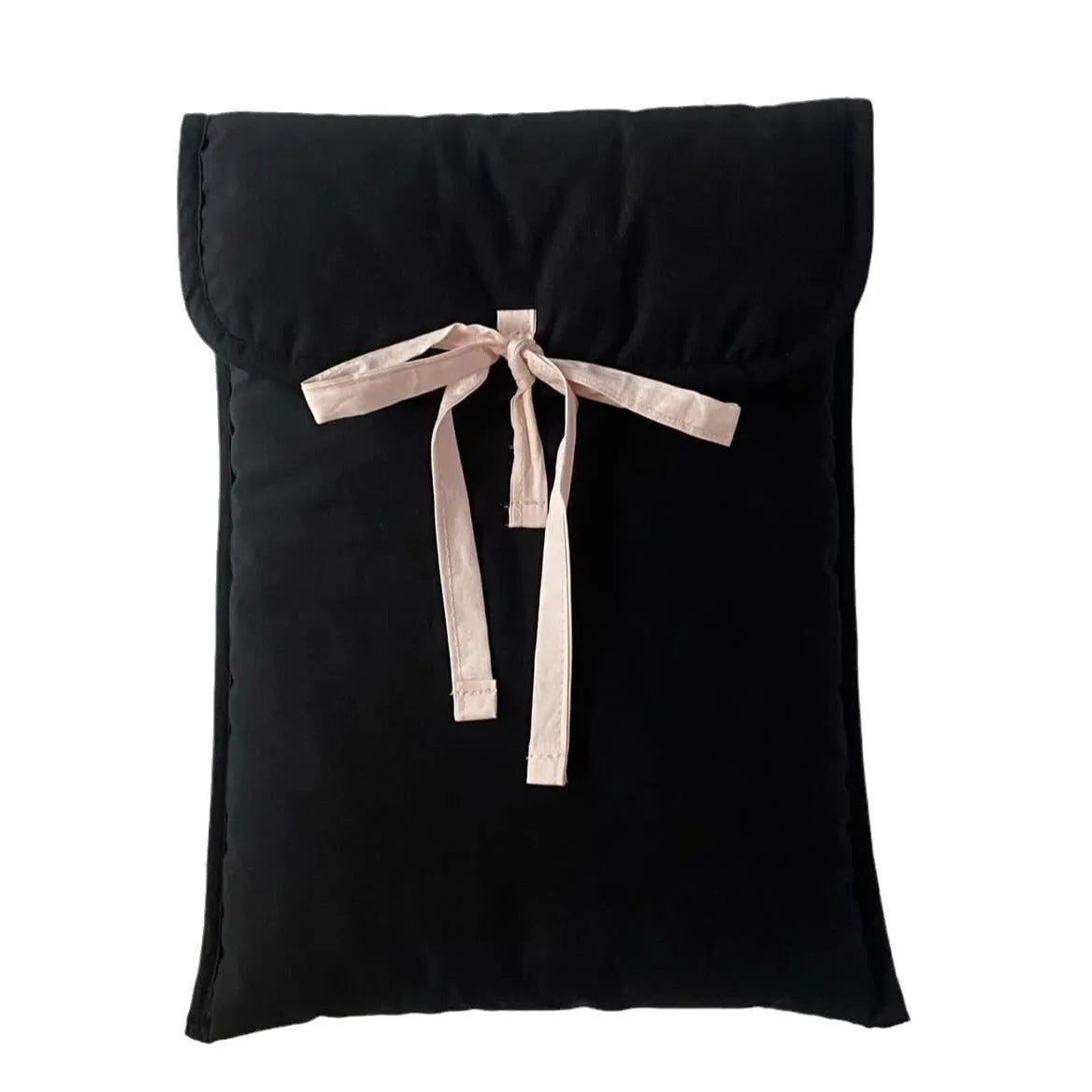 Black and white quilted laptop bag with a large ballet-style bow on the front.