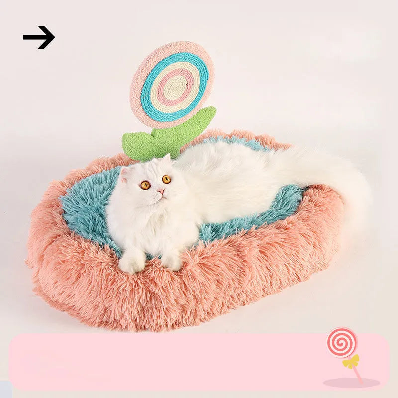 Pink plush elliptical cat bed with integrated lollipop-shaped bolster and removable cover