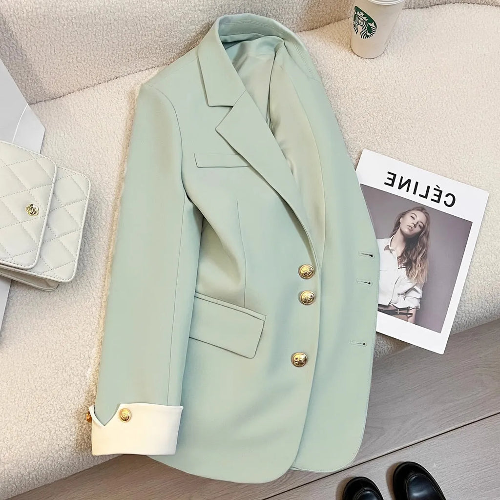 Korean style loose fit women's coat in milky white, showing front view with pockets.