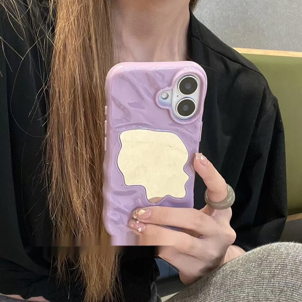 iPhone phone case with water ripple texture and a solid colour mirror back on a table
