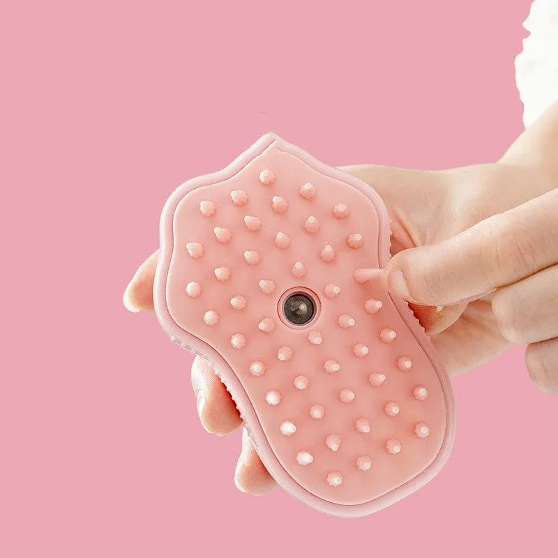 Cat paw style USB rechargeable pet spray massage brush on white background, compact ABS plastic grooming tool
