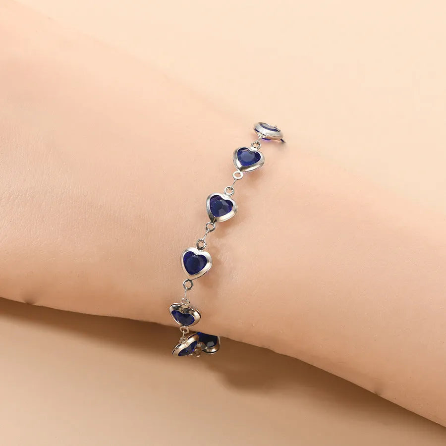Geometric stainless steel heart bracelet showing six electroplated colour options on white background