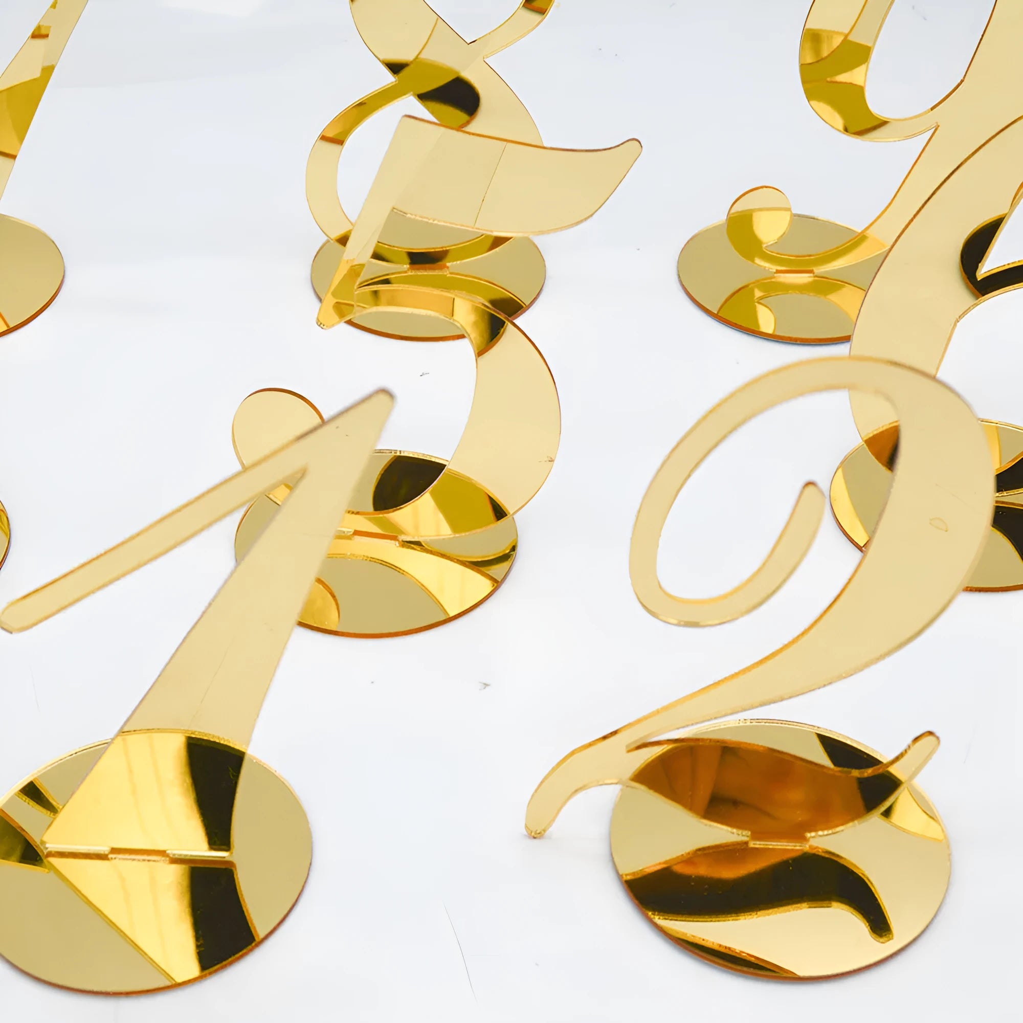 Clear acrylic table number holder with gold base displaying number 1 on a table