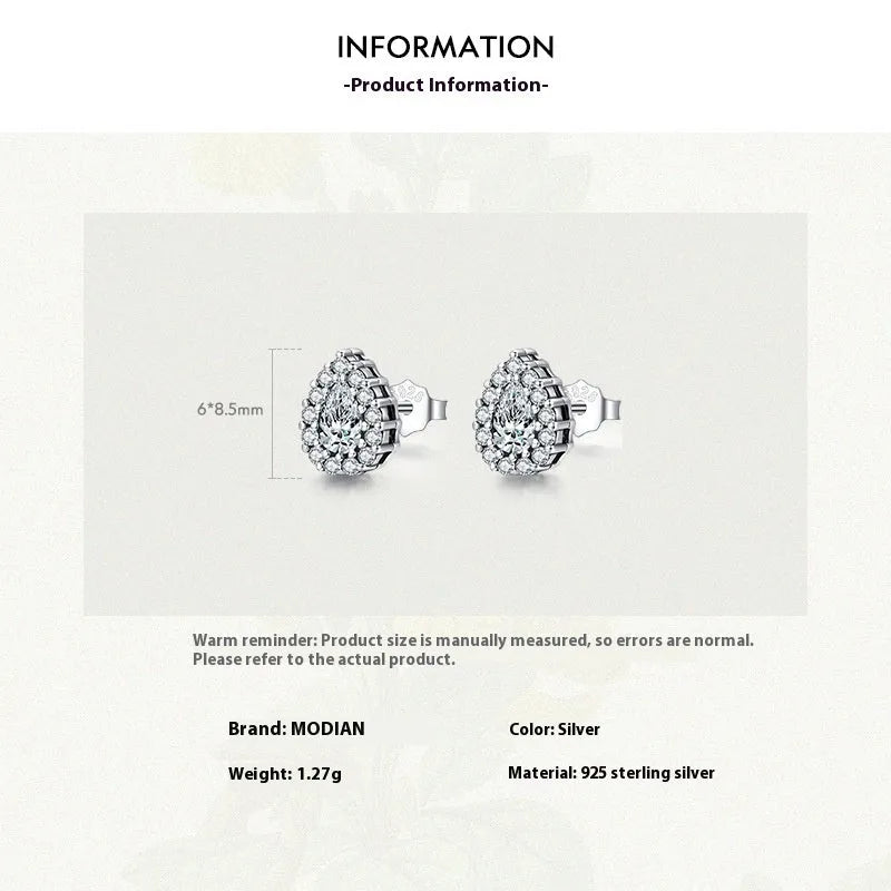 Women's silver drop ear studs in 925 sterling silver with diamond treatment finish