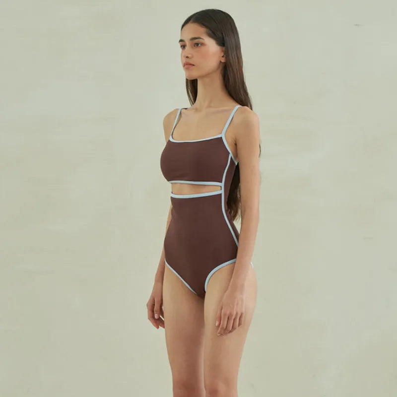 Brown women's one-piece triangle swimsuit showing front design on mannequin