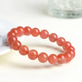 Polished South cherry red agate scattered bead bracelet shown in single and triple circle styles.