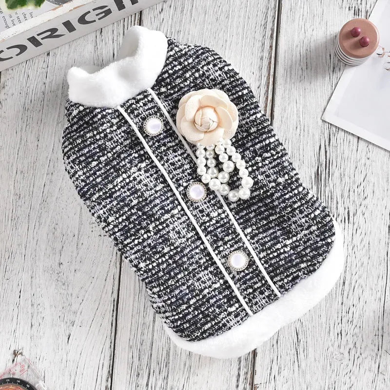 Black PU sausage jacket for cats shown on small feline model