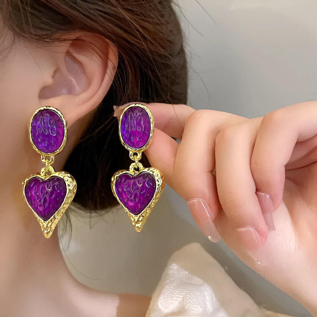Pleated oval love heart stud earrings in alloy, showing purple, red, green, and yellow with white colour variations.