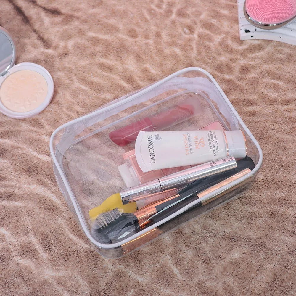 PVC transparent makeup bag set showing three semi-transparent bags in L and XL sizes