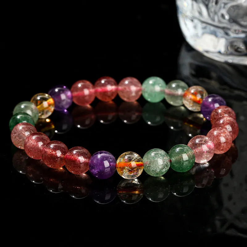 Women's strawberry quartz gemstone bracelet with round beads in a geometric pattern.