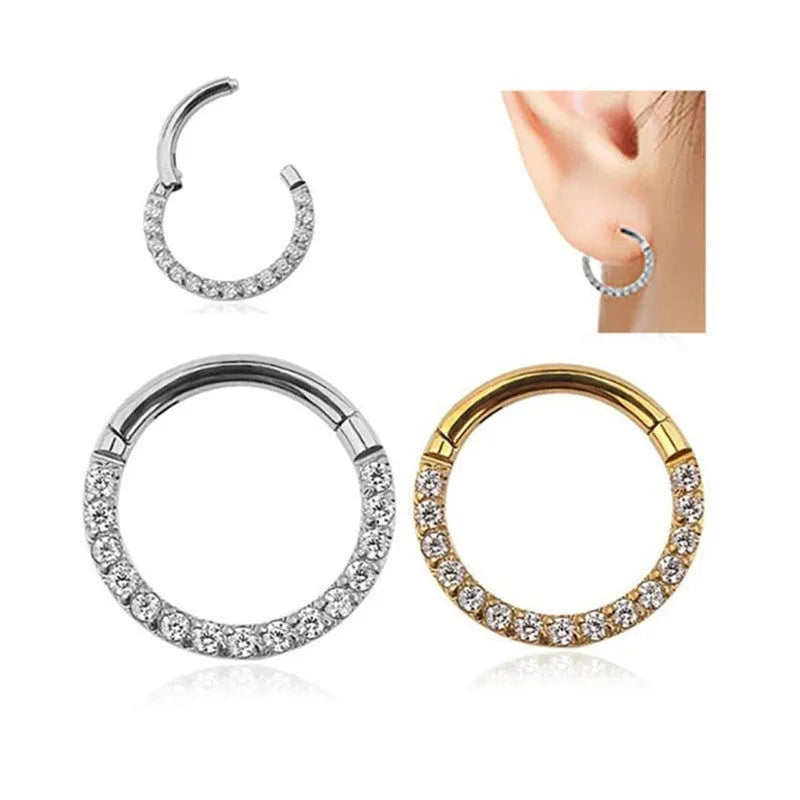 A stainless steel seamless nose ring with a diamond setting, shown in gold, rose gold, black, and steel finishes.