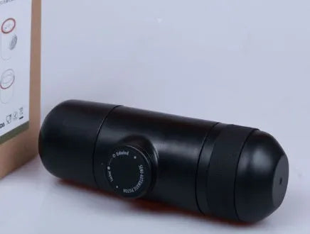 Black portable manual coffee machine showing compact 6x17.5cm design with stainless steel components