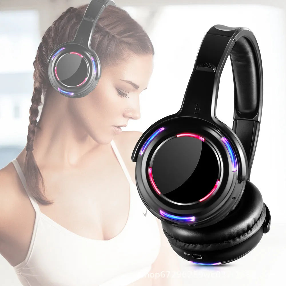 Black silent disco wireless headphones with over-ear design and a coiled 3.5mm cable.