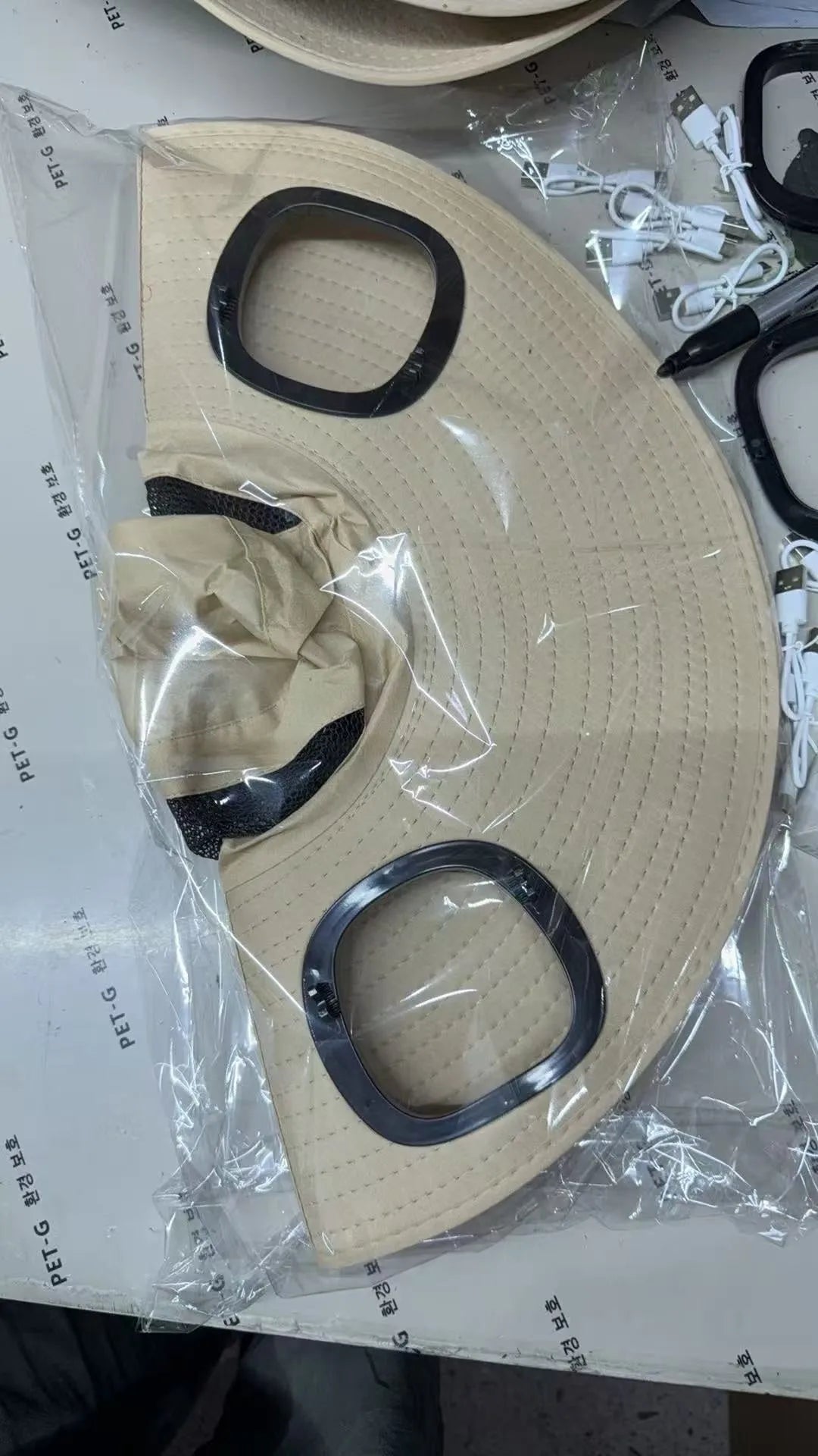 Men's grey solar fan cap with wide brim showing integrated cooling system