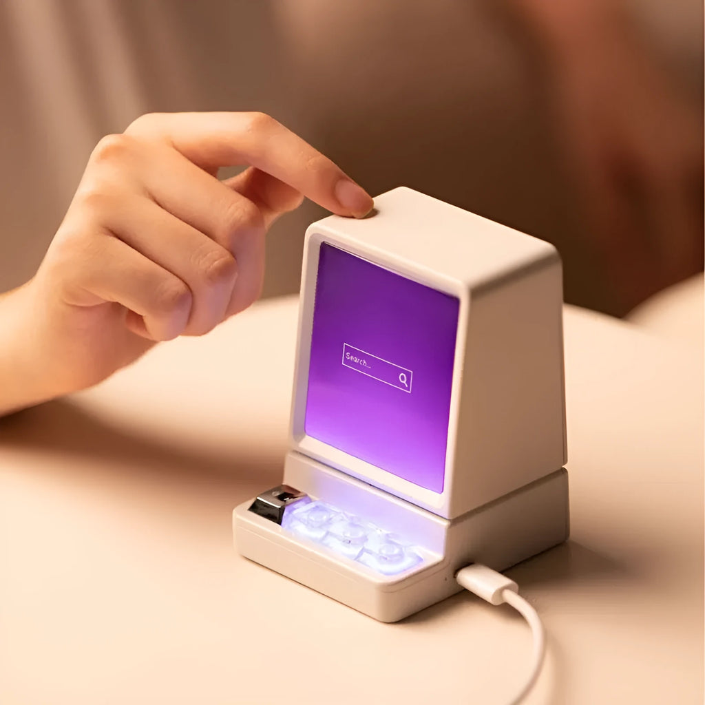 Portable computer-shaped Bluetooth speaker in light grey with lighting and voice prompt function