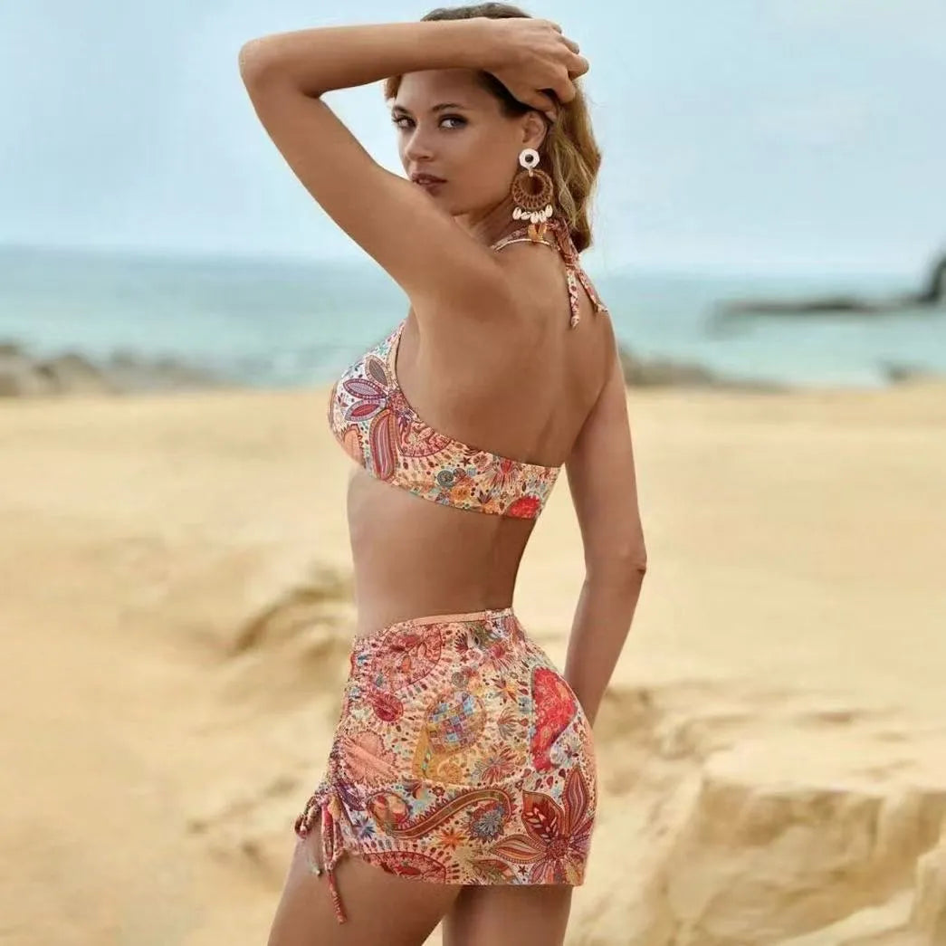 Women's three-piece swimsuit set with sling yarn top, bikini bottom, and tulle pleated net skirt in print colour