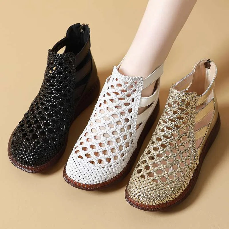 Women's flat gold sandals with hollow-out design and soft sole.