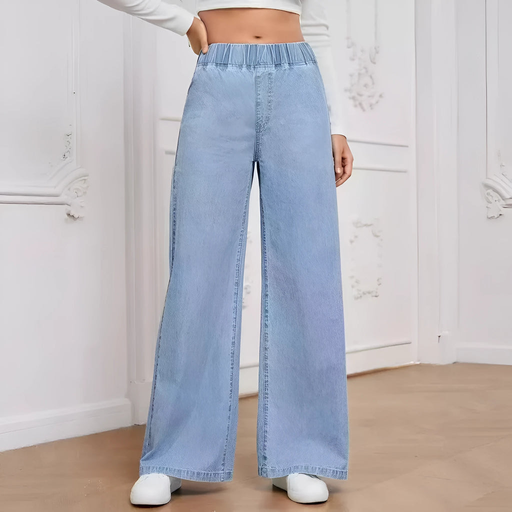 Light blue washed wide-leg straight-cut jeans on a hanger, showing mid-waist and zip fly detail.