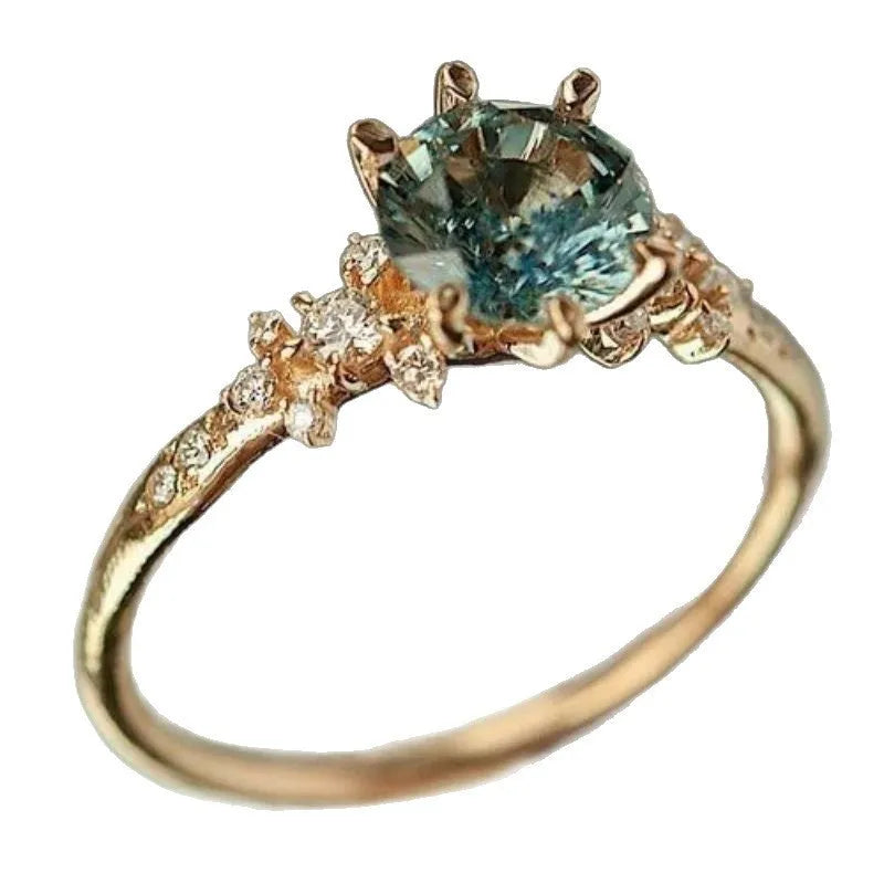 Gold geometric claw ring with micro inlaid zircon stones and chamfered square pattern
