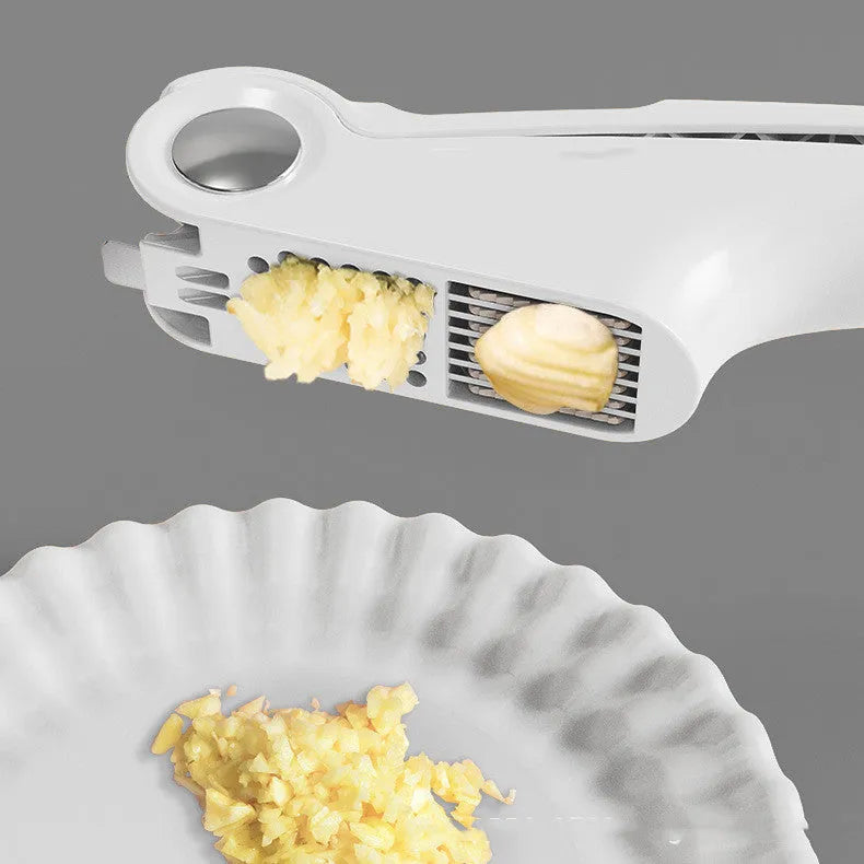 Manual garlic press in white colour with ABS plastic body and stainless steel mechanism