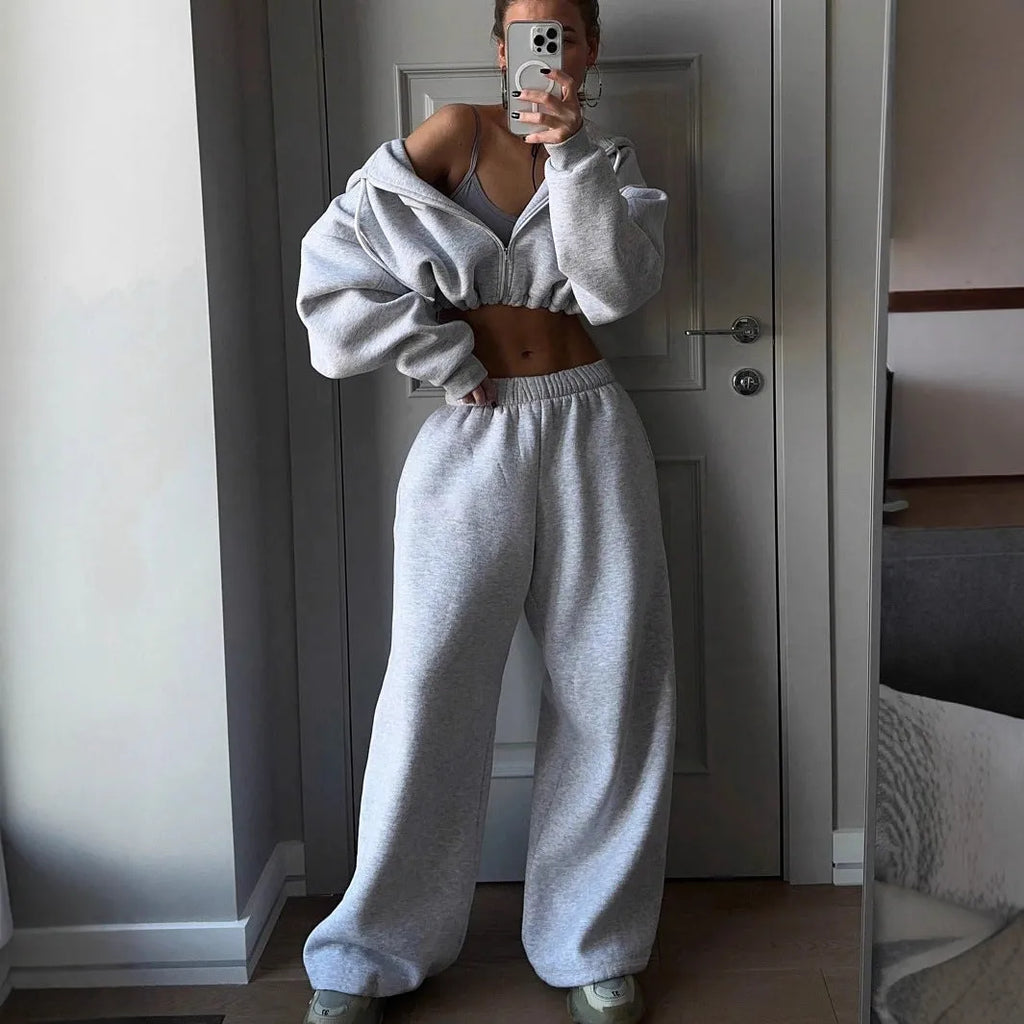 Long sleeve polyester sports suit two-piece set in light grey, shown as coat and trousers.