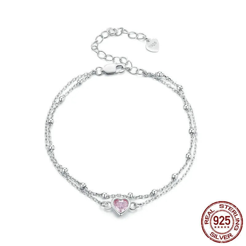 Sweet style sterling silver bracelet with small heart pendant on an adjustable chain.