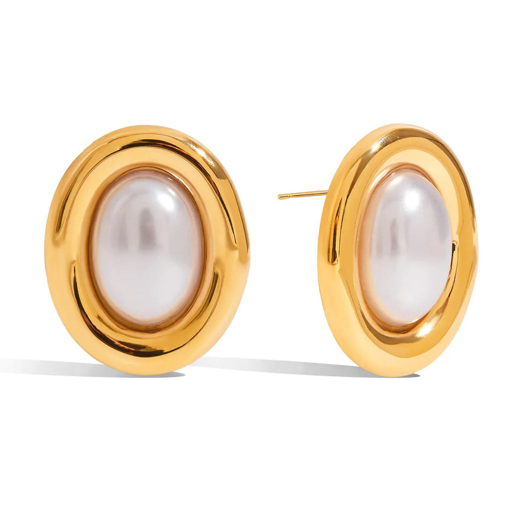 A pair of stainless steel stud earrings with a small vintage-style pearl drop and a non-fade electroplated finish.