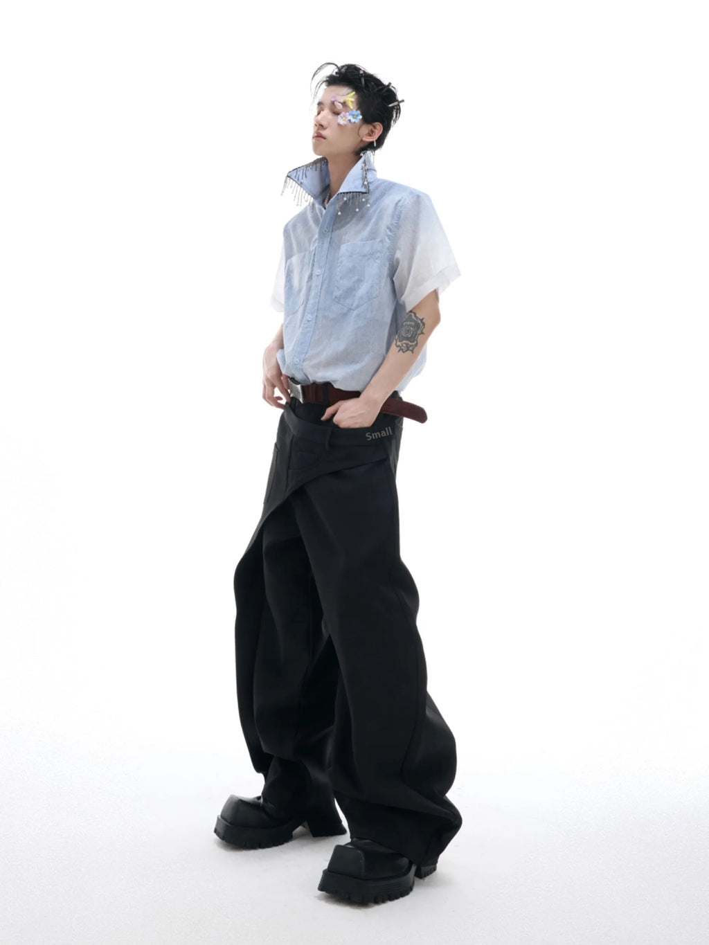 A blue and white gradient loose short-sleeve shirt on a hanger.