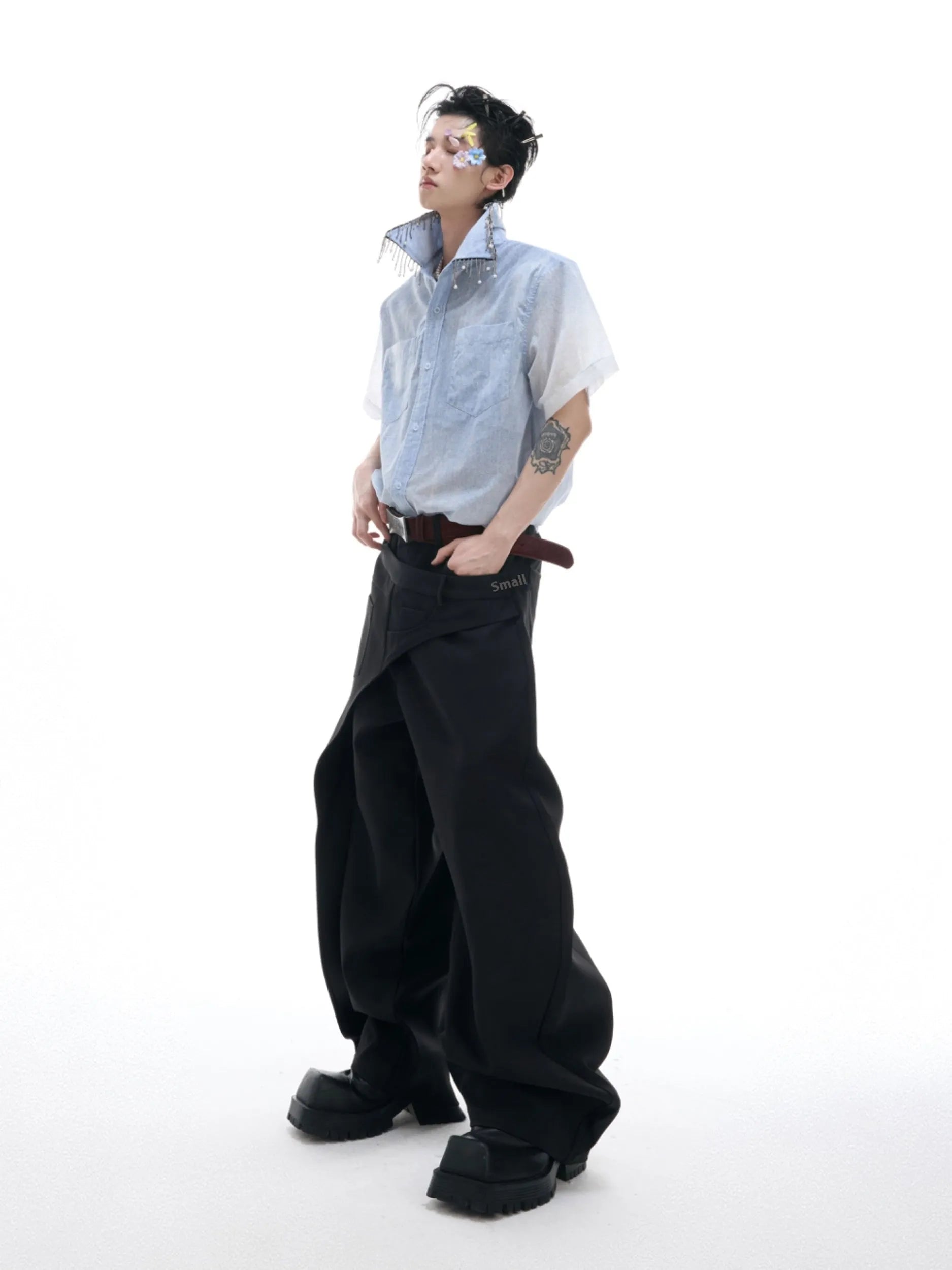 A blue and white gradient loose short-sleeve shirt on a hanger.