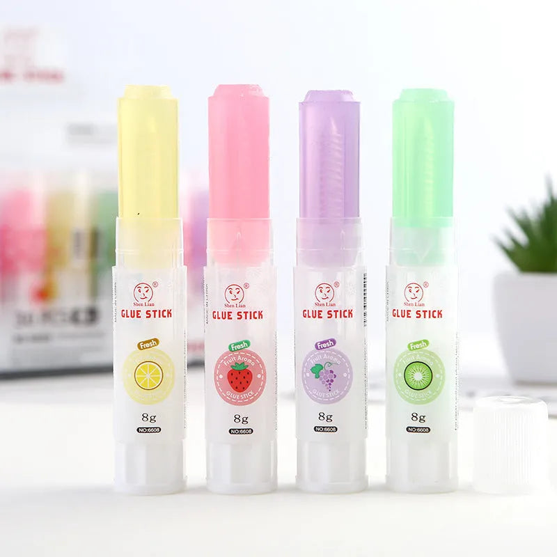 Jelly solid glue stick with fruit printing, 8.5 cm long, shown next to a ruler for scale.