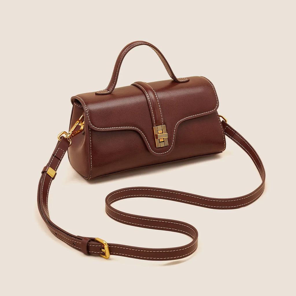 Brown Cambridge leather messenger bag with lock closure showing clamshell opening and internal organisers