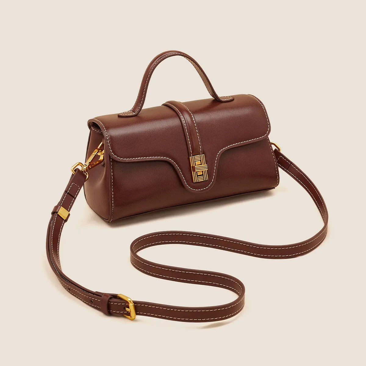 Brown Cambridge leather messenger bag with lock closure showing clamshell opening and internal organisers