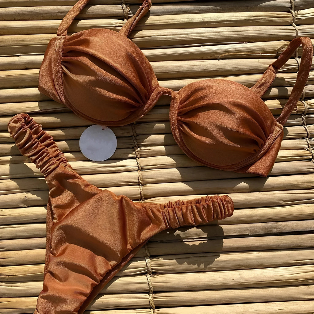 Women's khaki underwire bikini swimsuit with split briefs on a white background.