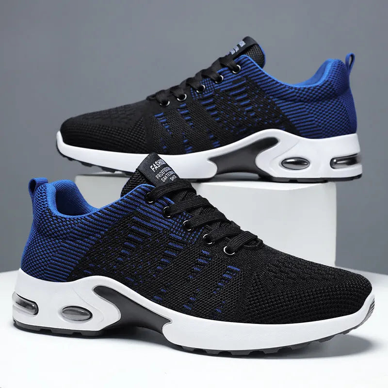Men's low-top Flyknit mesh sneaker in black and grey colour with lace-up front and soft sole.
