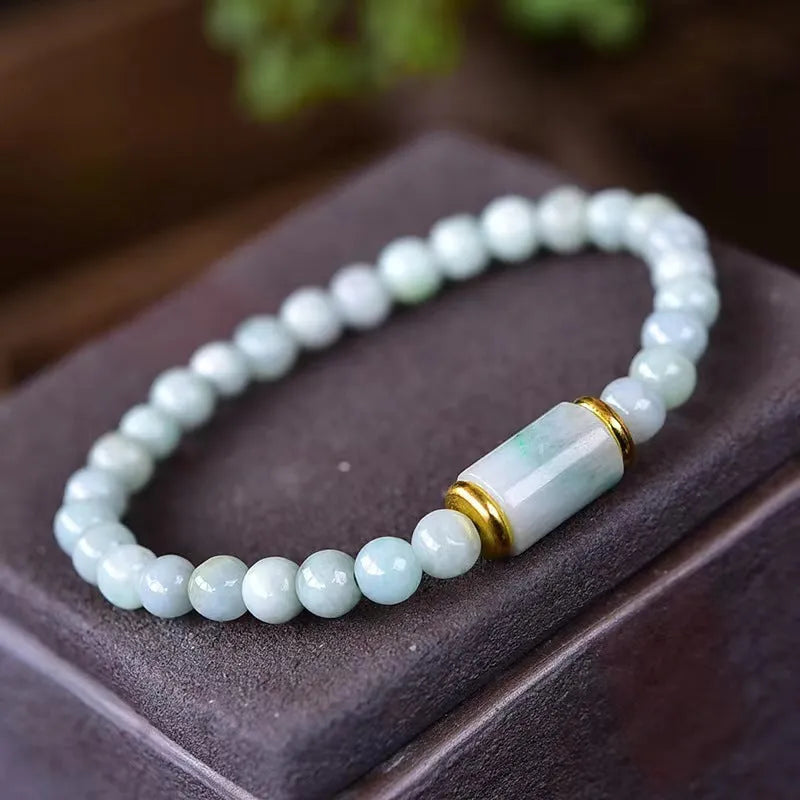Myanmar Jade round bead bracelet in emerald green with geometric ethnic style design