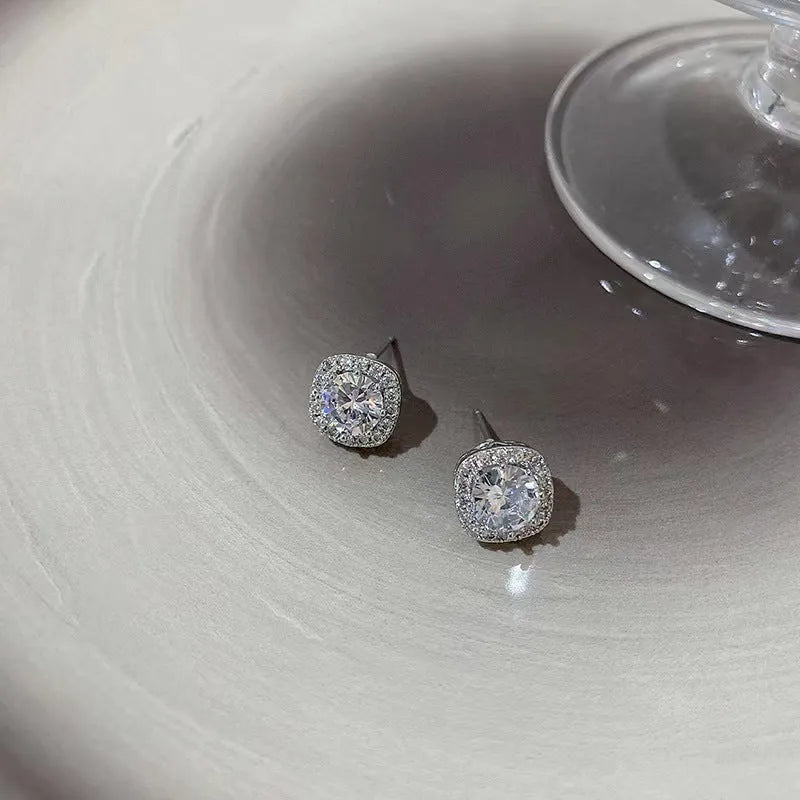 A pair of square geometric diamond-cut earrings for women in silver or gold colour.