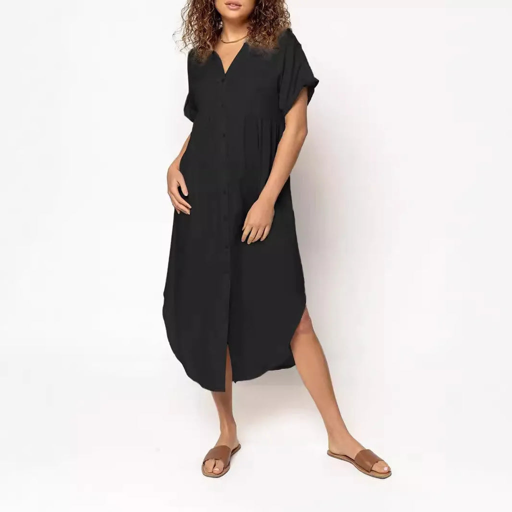 Loose mid-length casual dress in solid colour with button front detail, shown on a hanger.
