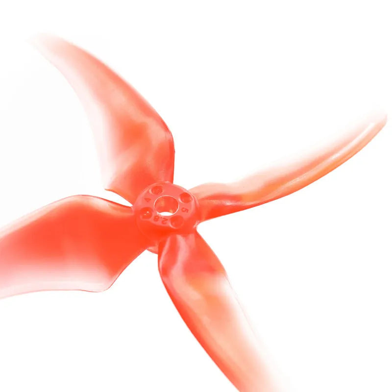 Red 5-inch crossing machine propeller with four plastic blades, shown as part of a two-pair set