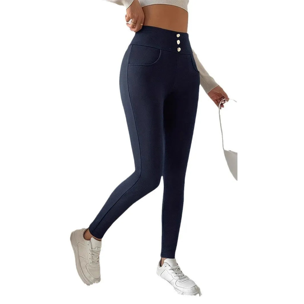 Navy blue women's high waist casual trousers with a straight leg fit on a hanger.