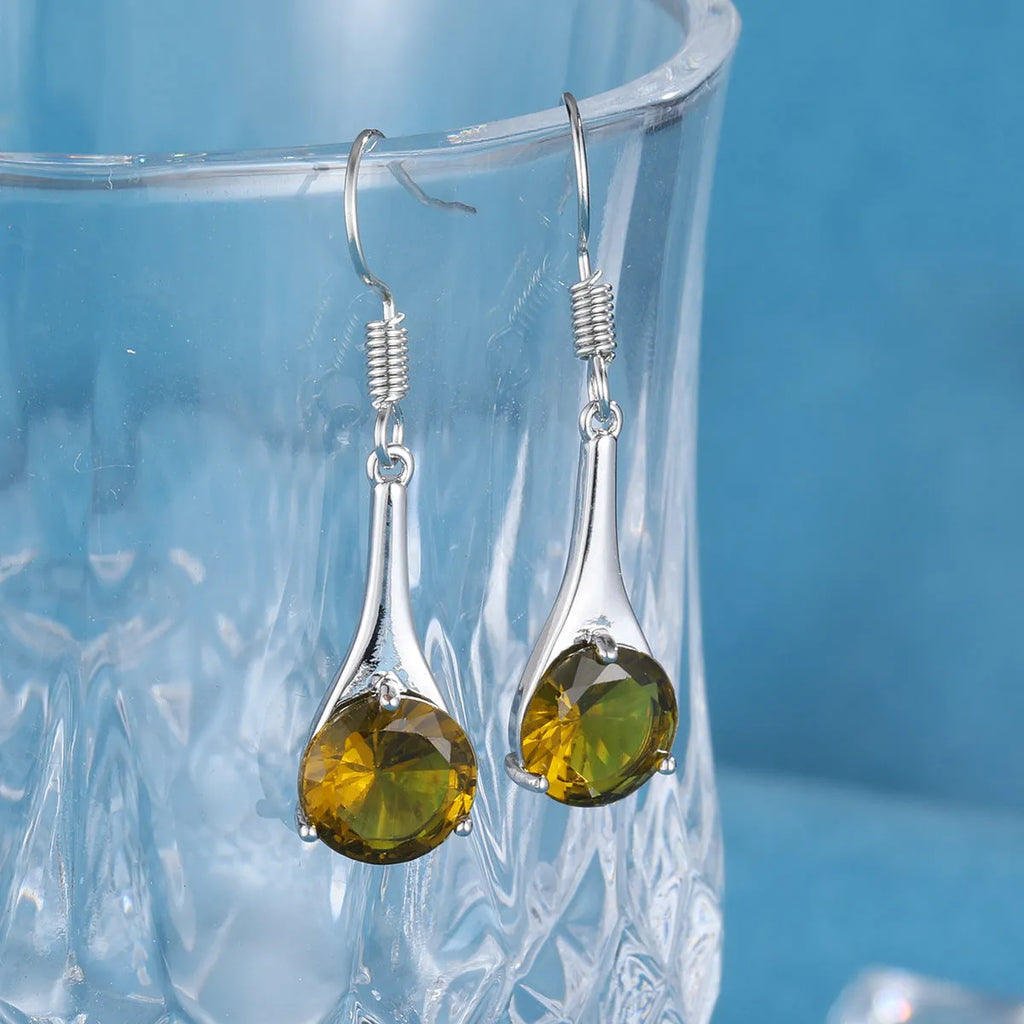 Olive green retro-style drop earrings with a minimalist water drop shape on a white background.