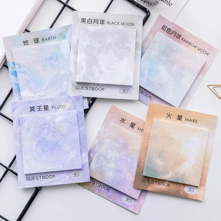 Square planet sticky notes pad showing oil painting designs of Earth, Mars, and moons at 7.3cm size.