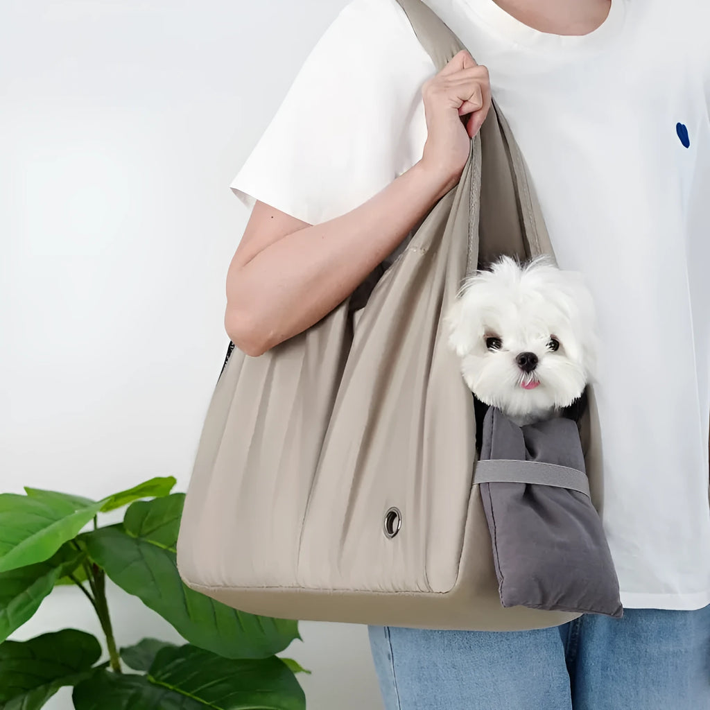 Apricot coloured cloth pet carrier handbag showing portable size.