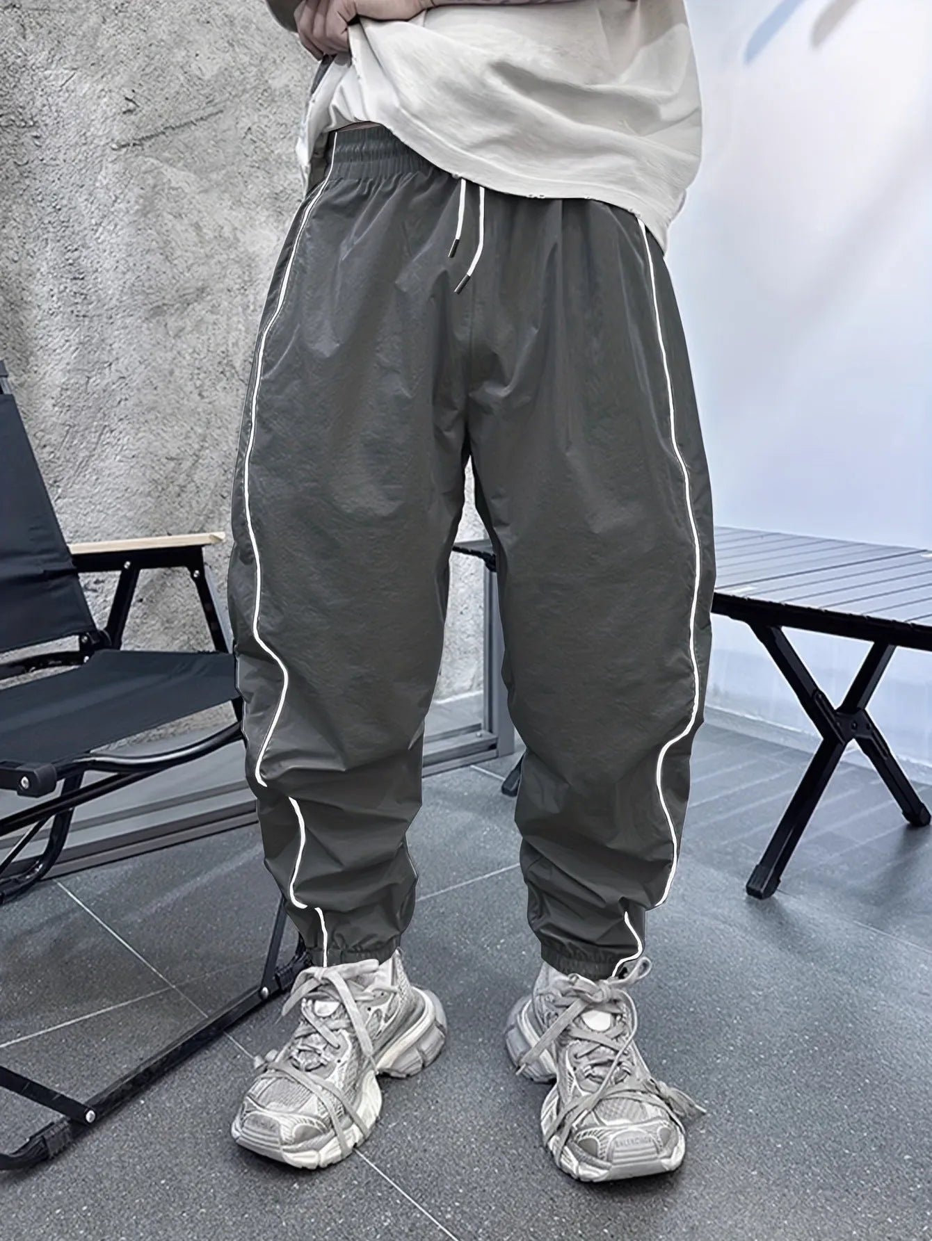 Men's blue bamboo fibre cropped casual sports trousers on a hanger.