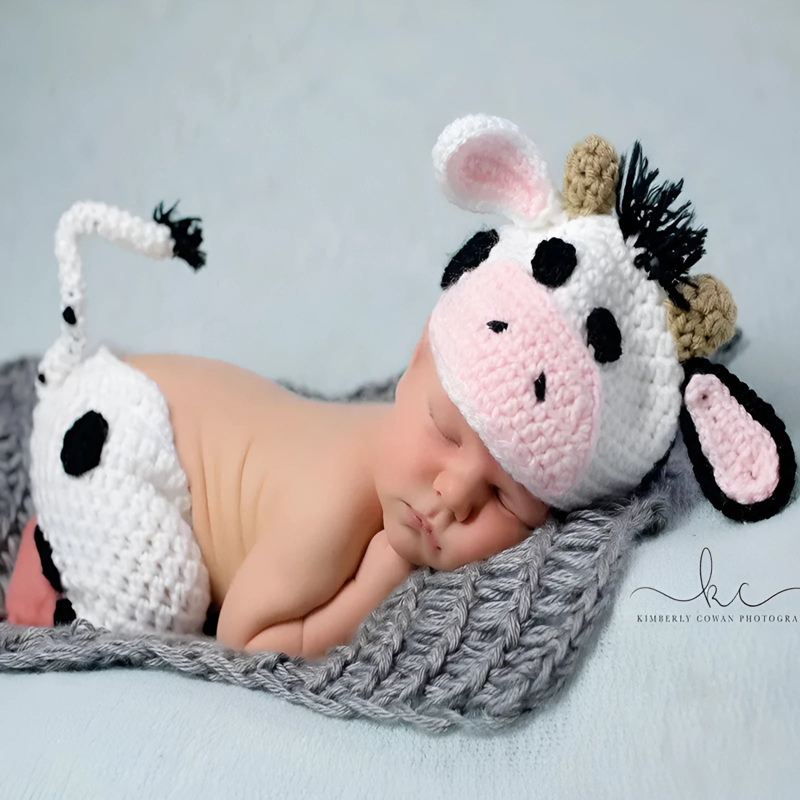 Hand-knitted white baby cow suit with matching hat for 0-3 month newborns