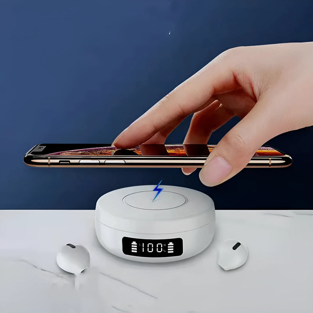 Small black wireless semi-in-ear headphones placed inside their white wireless charging case.