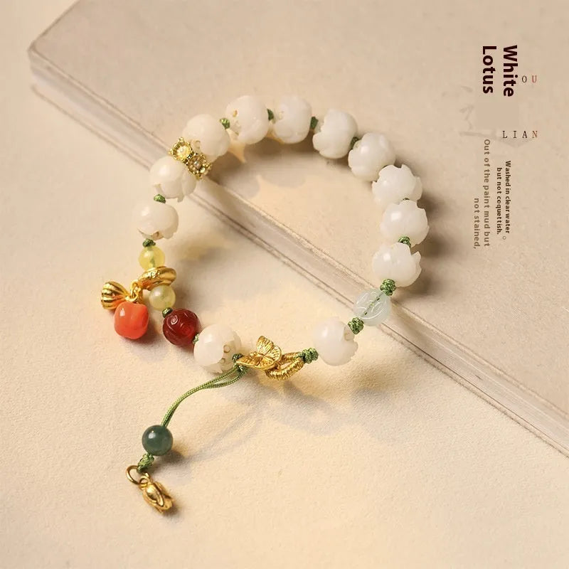 Hand-woven white jade bodhi bracelet showing pumpkin and lotus beads on adjustable open rope