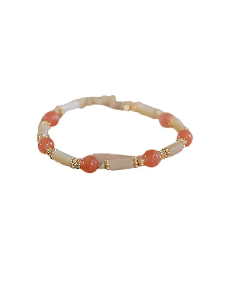 Hetian jade bamboo joint bracelet for women in 6mm size, shown in jade green and South red colour options.