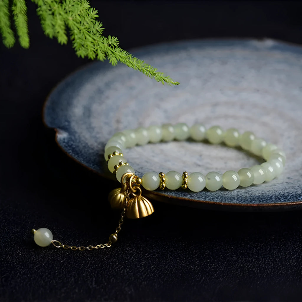 Natural Hetian jade bracelet with 6mm lotus beads and fu character element