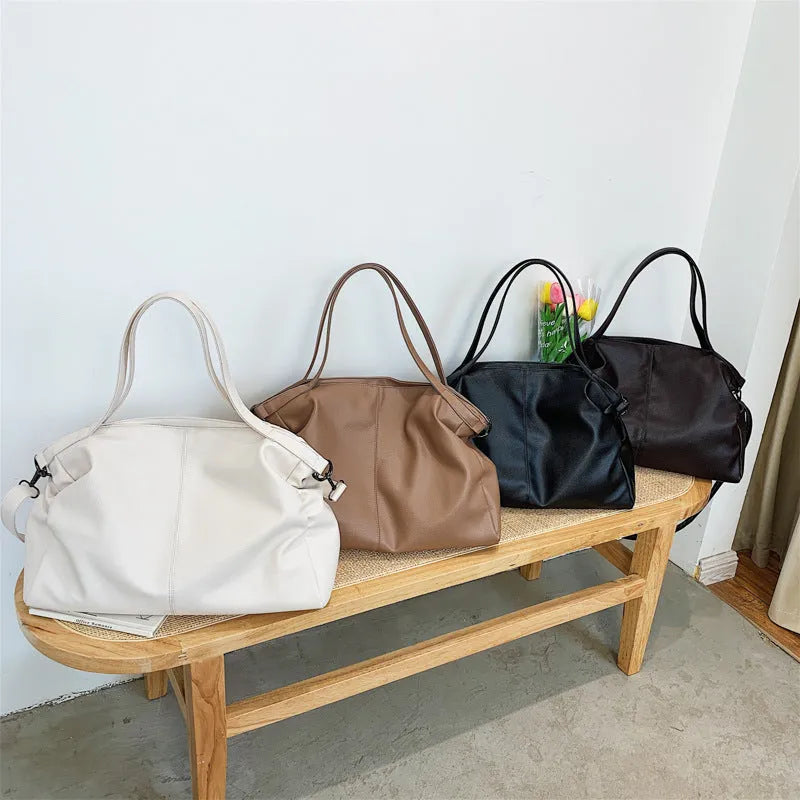Large soft surface PU messenger bag with zipper opening and internal organisation pockets