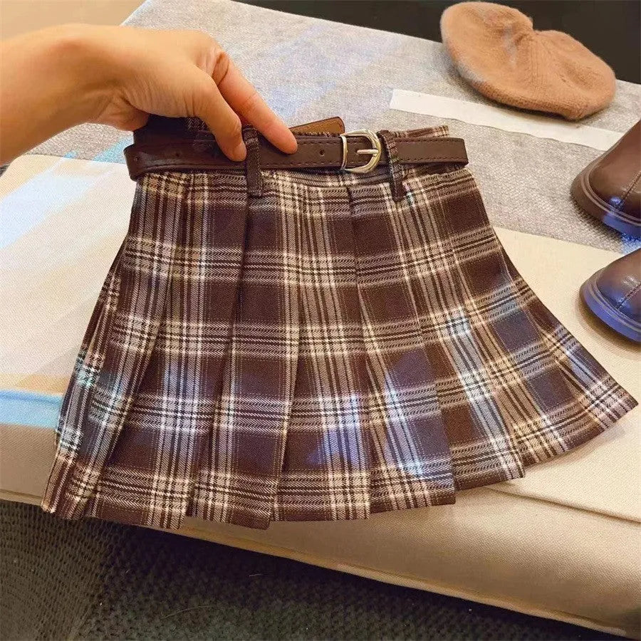 Girls' plaid pleated A-line skirt in a cotton blend fabric, shown on a hanger.